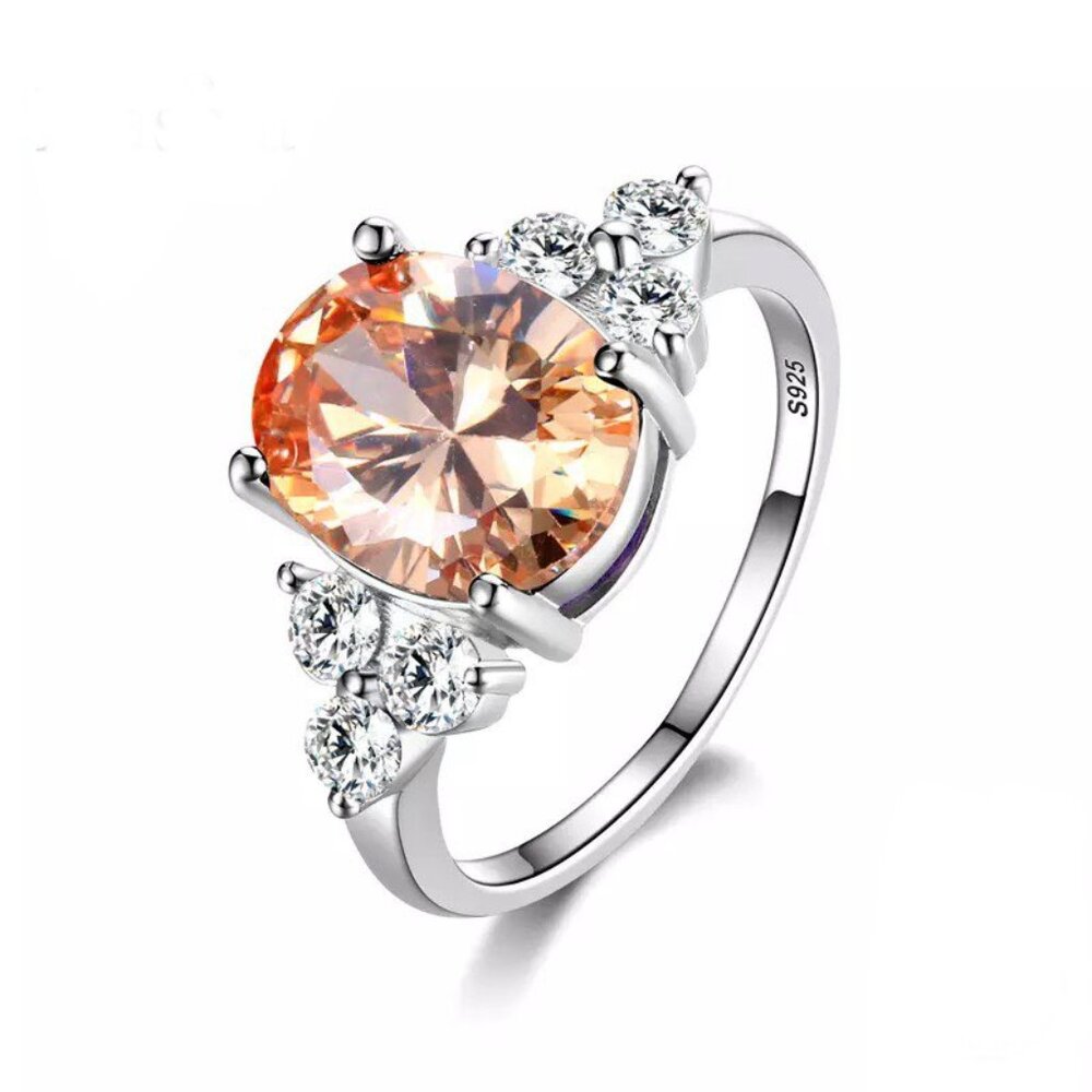 Women's Topaz Ring is Oval Cut with CZ Accents on a Sterling Silver Setting